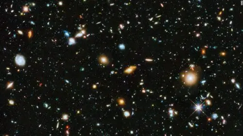 140604150129-hubble-color-galaxies-super-tease - YecHeadquarters This is an image of space taken from a telescope and it shows a bunch of stars and galaxies that are way far off.